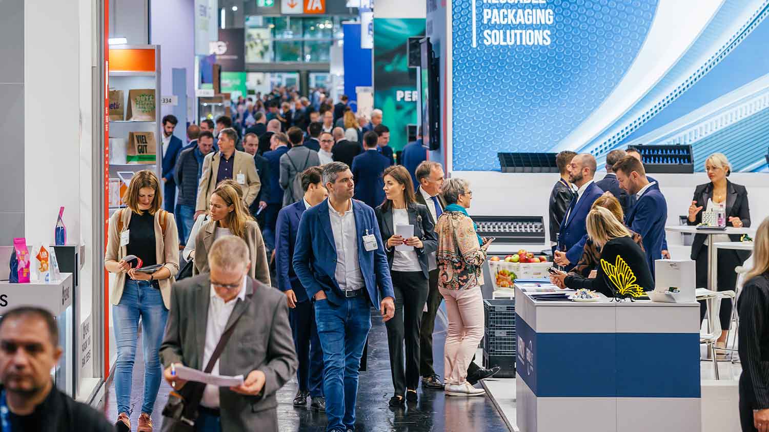 Visitors walk around the fair and stop by the exhibitors' booths