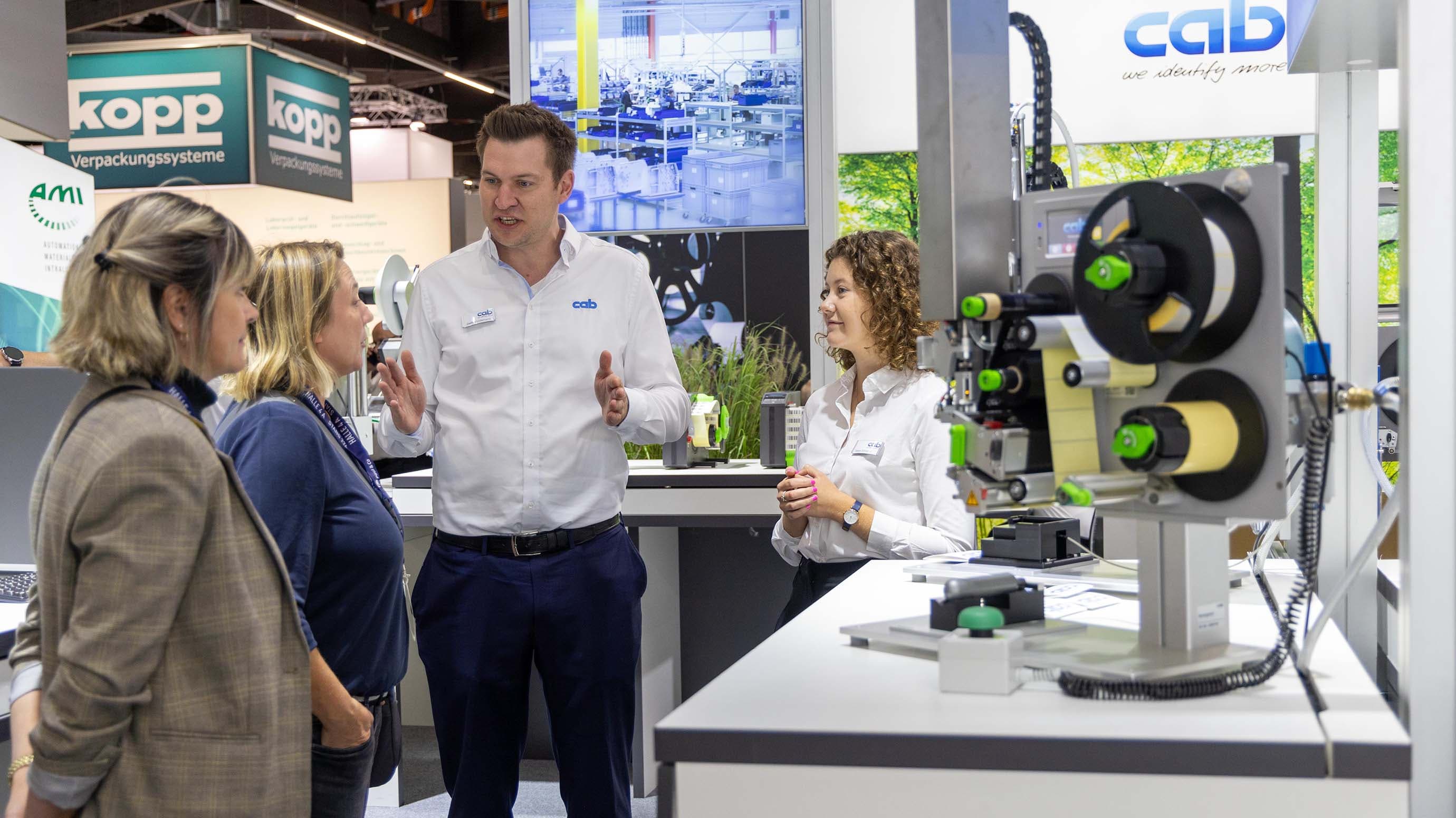 An exhibitor presents an exhibit to visitors