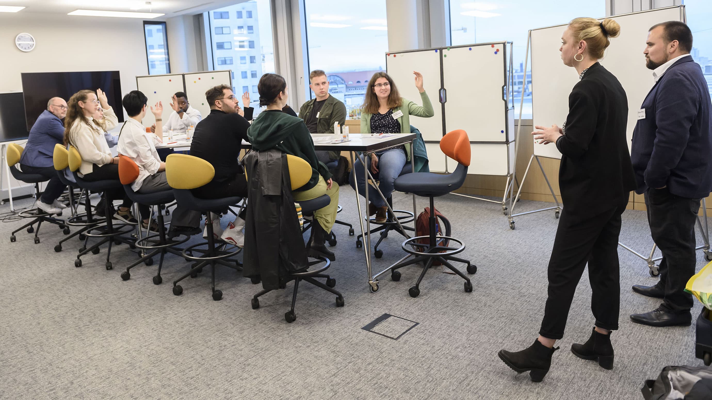 Two experts give a lecture to students